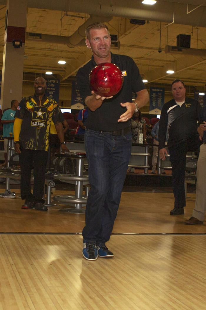 Nascar professional Clint Bowyer eyes his shot while bowling at South Point on Monday, Aug. 12, ...