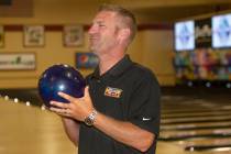 Nascar professional Clint Bowyer smiles as he prepares to eye his shot during a bowling match a ...