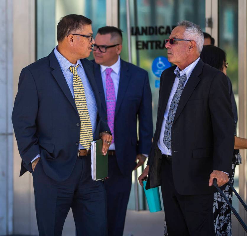 Defendants Cesar Morales, left, and Diego Garcia with counselor Shawn Perez outside the Lloyd D ...