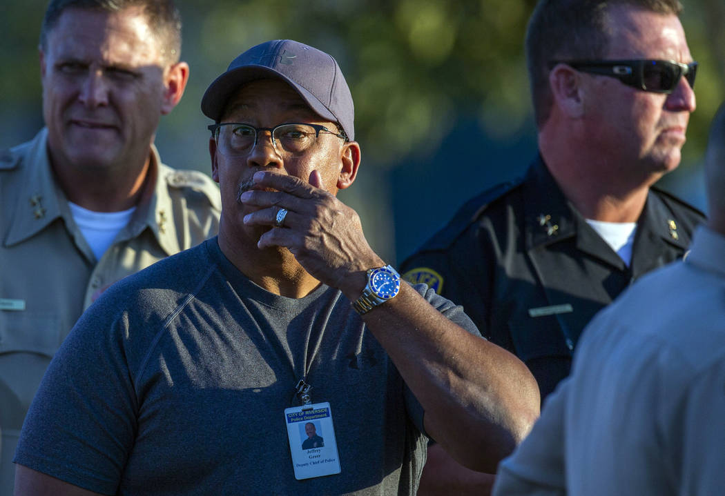 Riverside City Deputy Chief of Police Jeffrey Greer reacts at the scene where a shootout near a ...