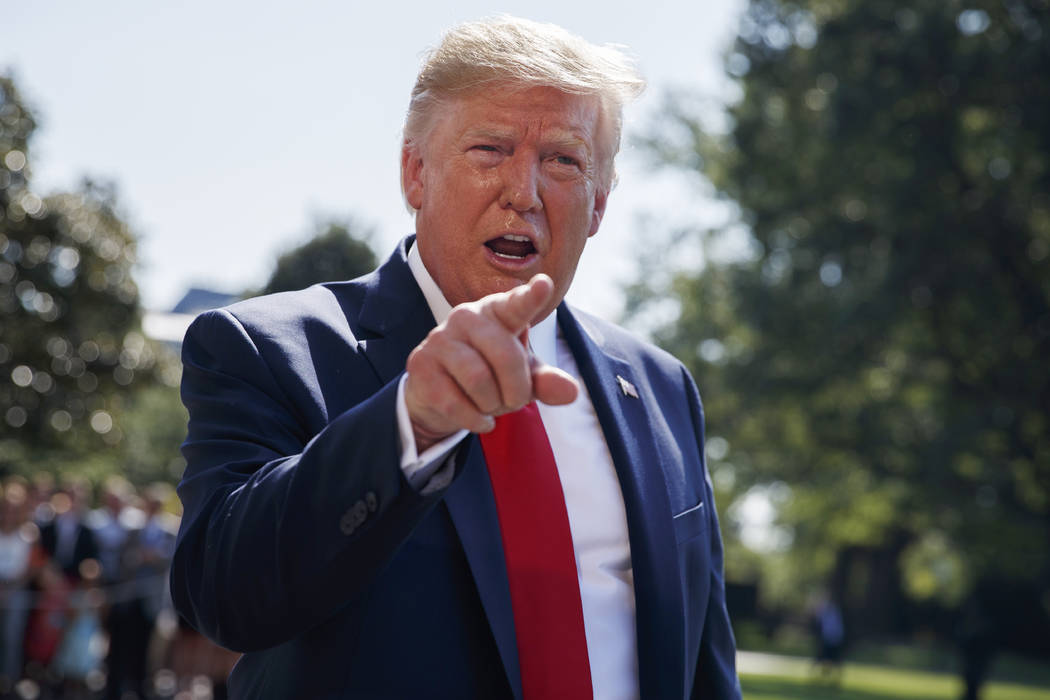 In this Aug. 9, 2019, photo, President Donald Trump talks to reporters on the South Lawn of the ...