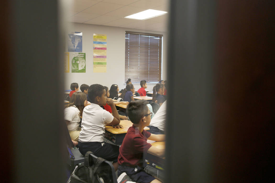 Students participate in their fifth grade class at Legacy Traditional School during the opening ...