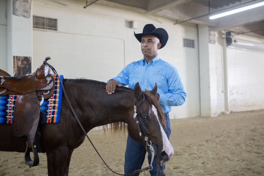 Reining expert Matt Mills finishes practicing his reining pattern at the South Point Arena in L ...