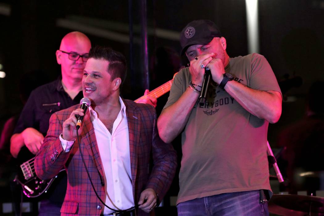 Mondays Dark founder Mark Shunock and UFC legend Randy Couture perform "A Hard Day's Night" at ...