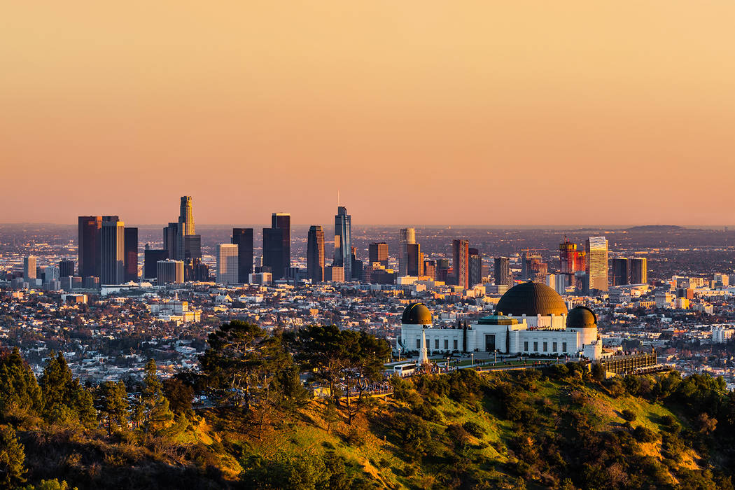 Los Angeles skyscrapers and Griffith Observatory at sunset (Getty Images)