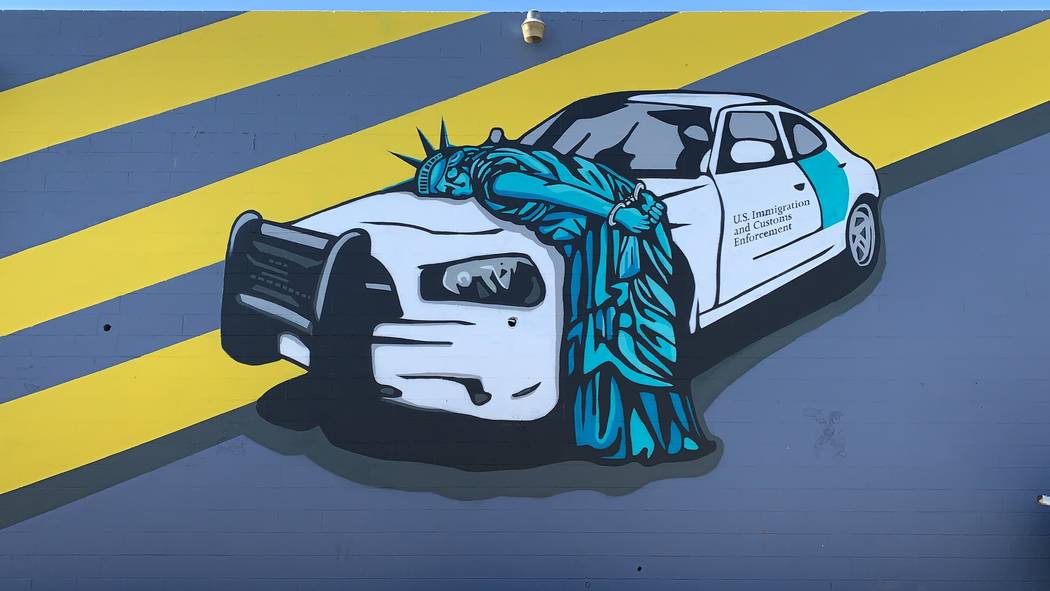 Recycled Propaganda's mural in the Arts District depicting the Statue of Liberty being arrested ...