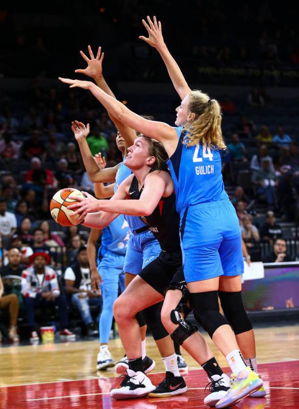 Las Vegas Aces center Carolyn Swords looks to shoot under pressure from Atlanta Dream's Marie G ...