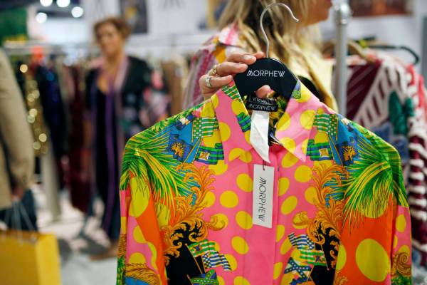 Morphew founder Bridgette Morphew holds a vintage original Versace women's blouse at the Morphe ...