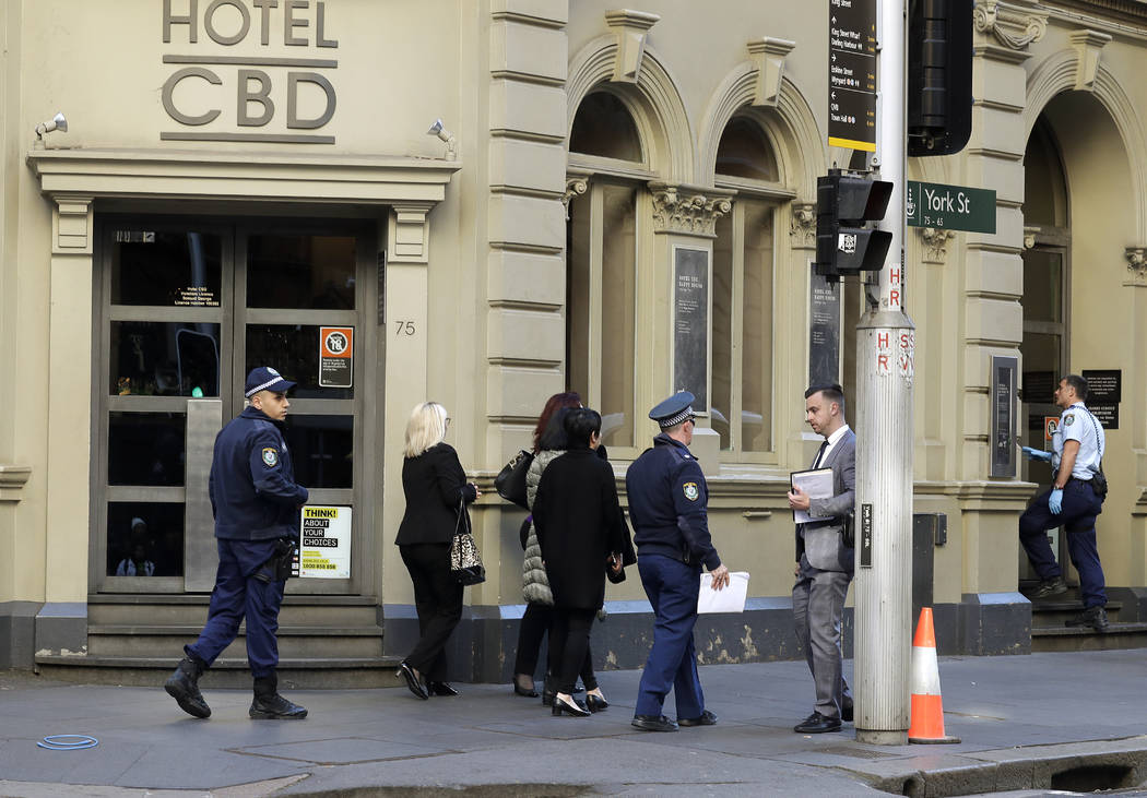 Police work at a scene where a man attempted to stab multiple people in Sydney, Australia, Tues ...