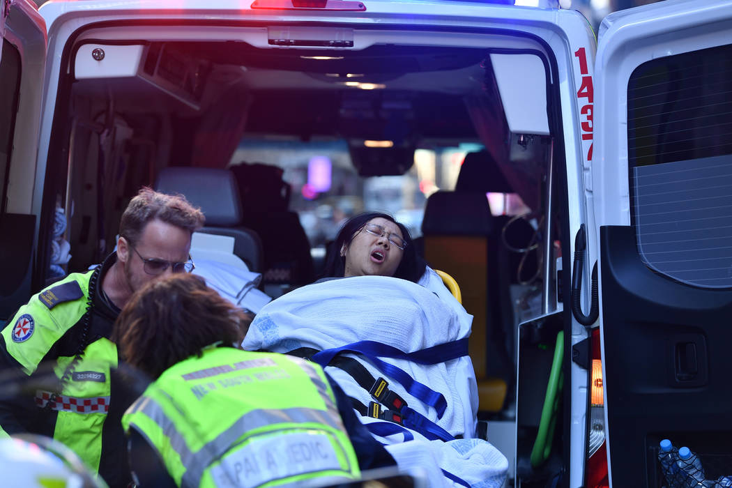 A women is taken by ambulance from Hotel CBD at the corner of King and York Street in Sydney, A ...