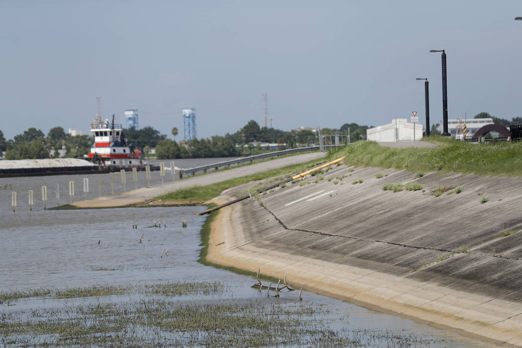 In this July 25, 2019, photo, Water lines and receding water are seen on the backside of the Mi ...