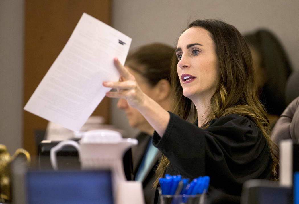 District Judge Jacqueline Bluth hands over some paperwork during sentencing for Andrew Arevalo ...