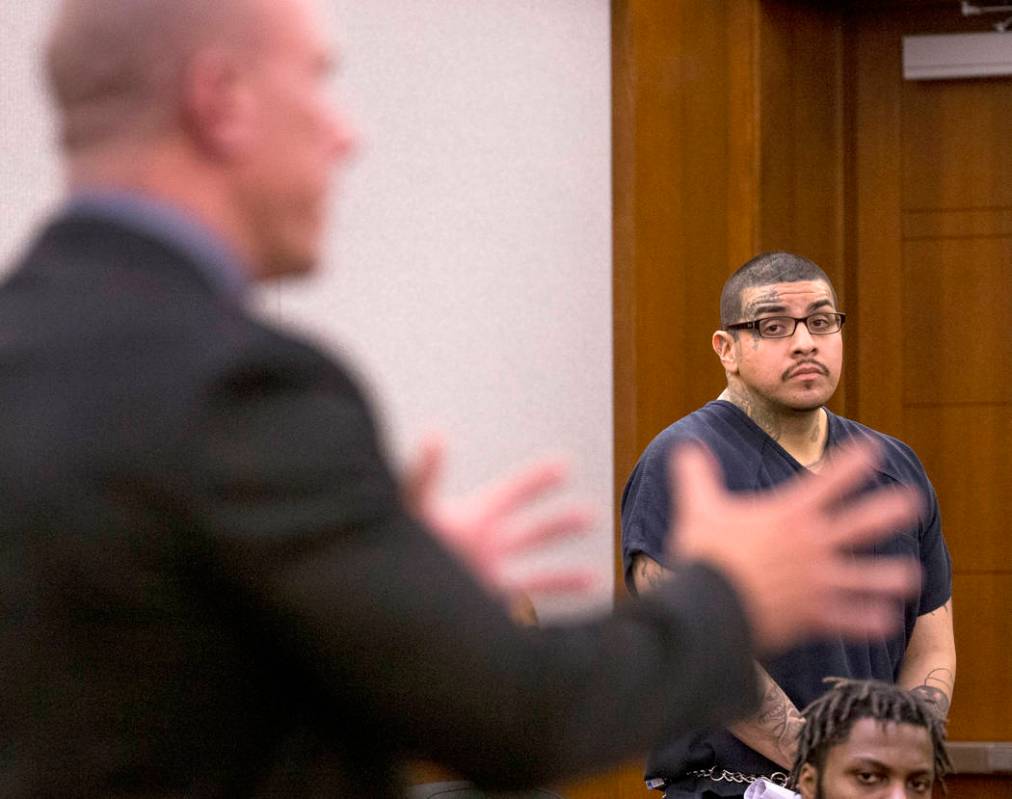 Andrew Arevalo, right, listens to defense attorney Dan Gilliam plead on his behalf during sente ...