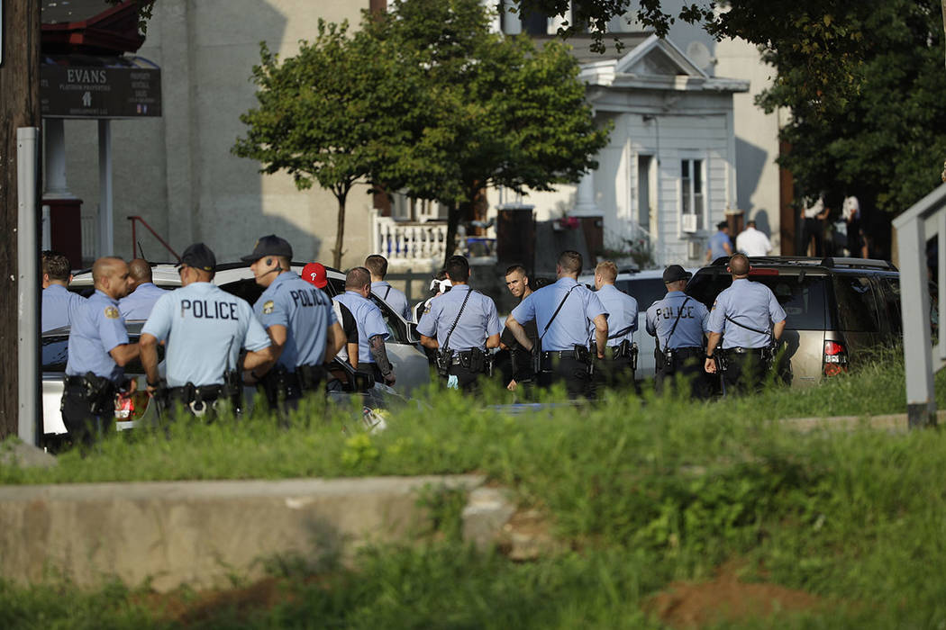 Authorities stage as they respond to an active shooting situation, Wednesday, Aug. 14, 2019, in ...