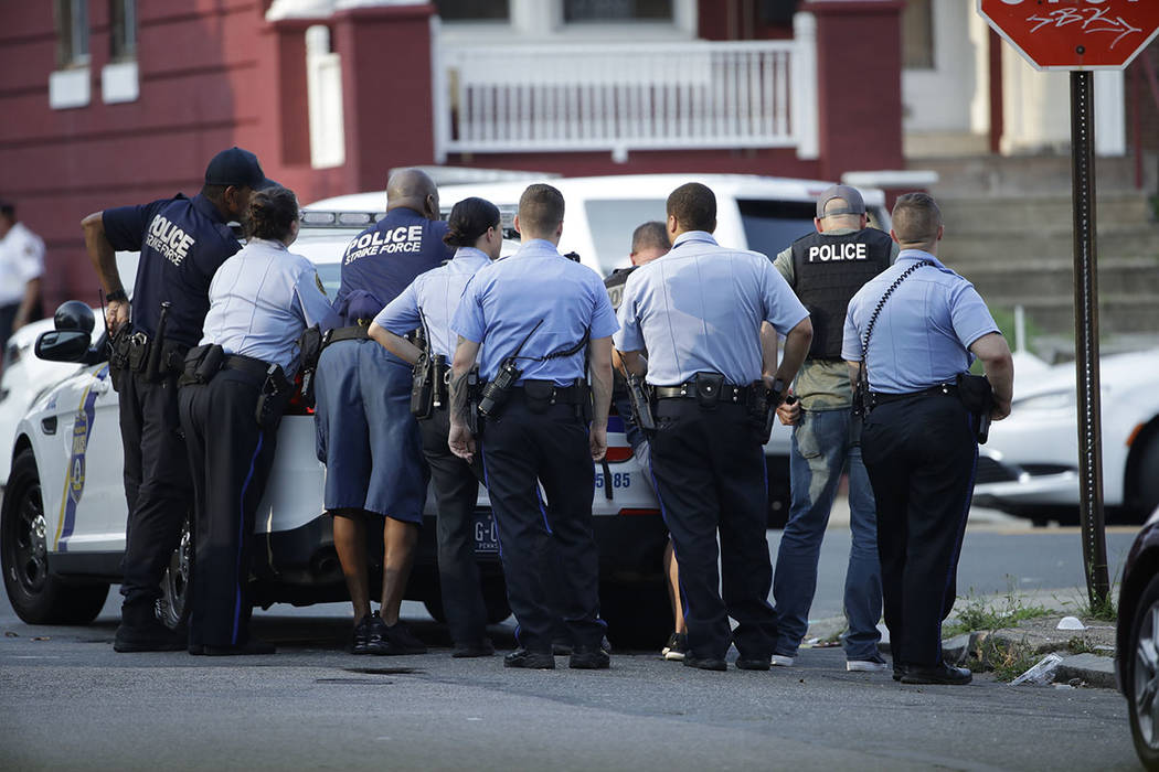 Philadelphia police stage as they respond to an active shooting situation, Wednesday, Aug. 14, ...