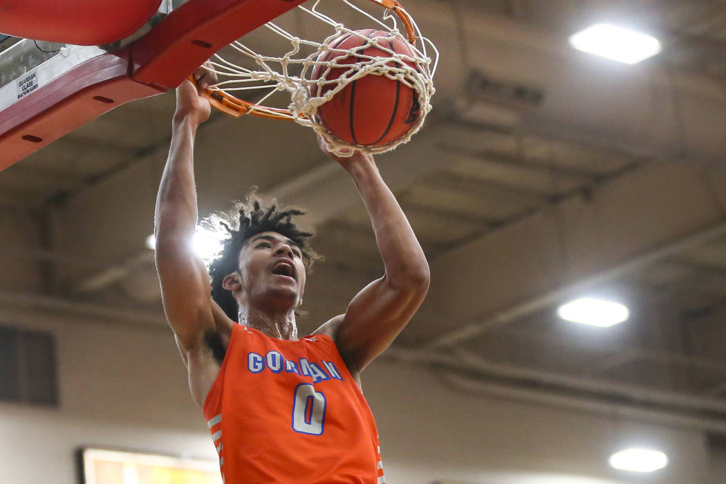 Bishop Gorman's Isaiah Cottrell (0) dunks over Findlay Prep's Alex Tchikou during the first hal ...