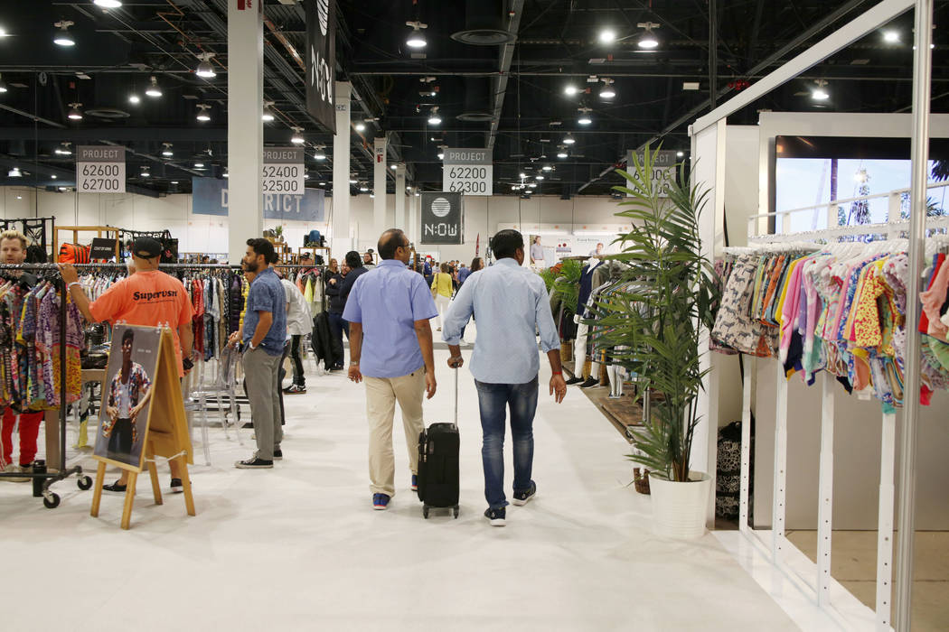Attendees walk the show floor during the third day of the MAGIC trade show at the Las Vegas Con ...