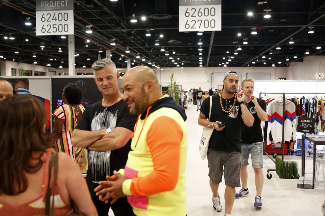 Attendees walk the Project floor during the third day of the MAGIC trade show at the Las Vegas ...