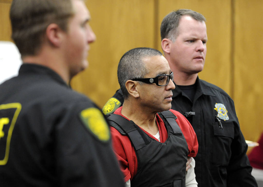 Vagos motorcycle gang member Ernesto Gonzalez is led from district court under heavy security i ...