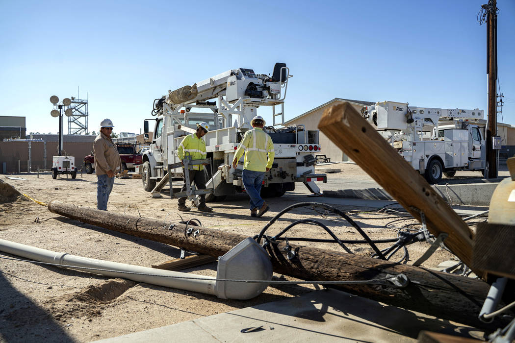 In this July 10, 2019 photo provided by the U.S. Navy, civilian workers assigned to Naval Air W ...