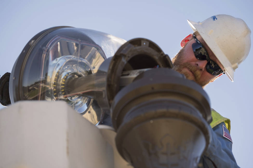 In this July 18, 2019 photo provided by the U.S. Navy, Tim Goodwin, a high-voltage electrician ...