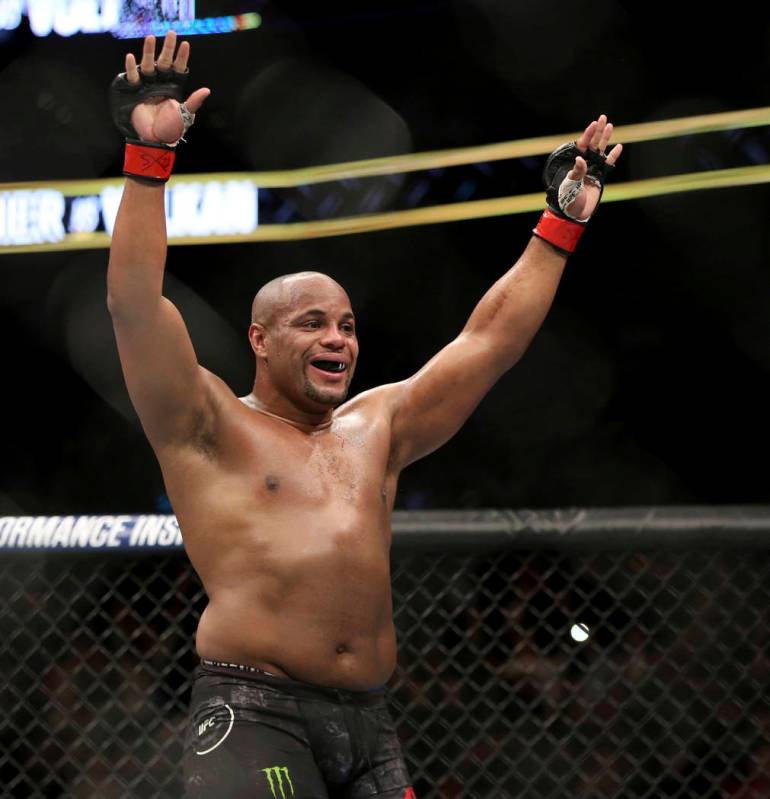 Daniel Cormier celebrates a win over Volkan Oezdemir in a light heavyweight championship mixed ...