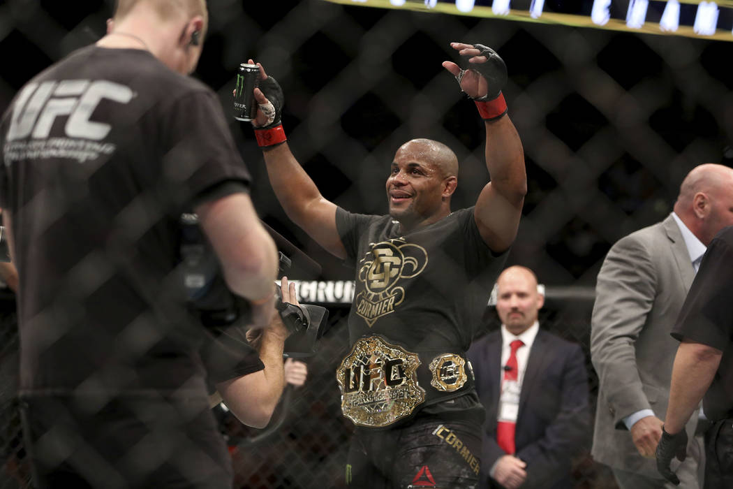 Daniel Cormier wears the belt after a win over Volkan Oezdemir in a light heavyweight champions ...