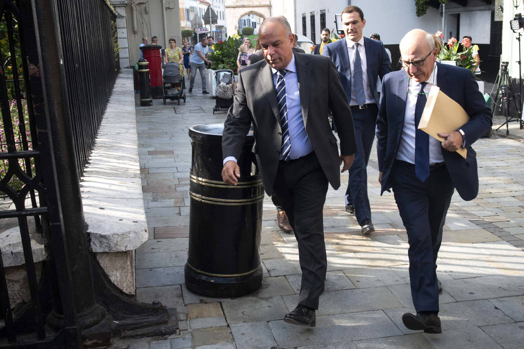 Attorney General for Gibraltar Michael Llamas, left, arrives at the court in the British territ ...