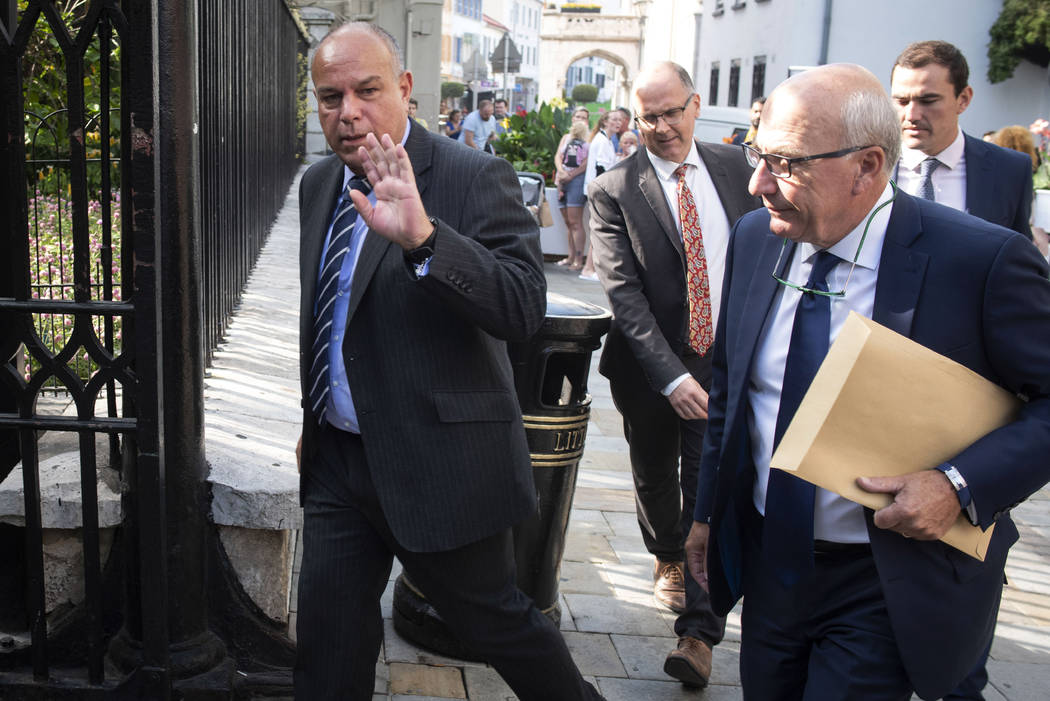 Attorney General for Gibraltar Michael Llamas, left, arrives at the court in the British territ ...