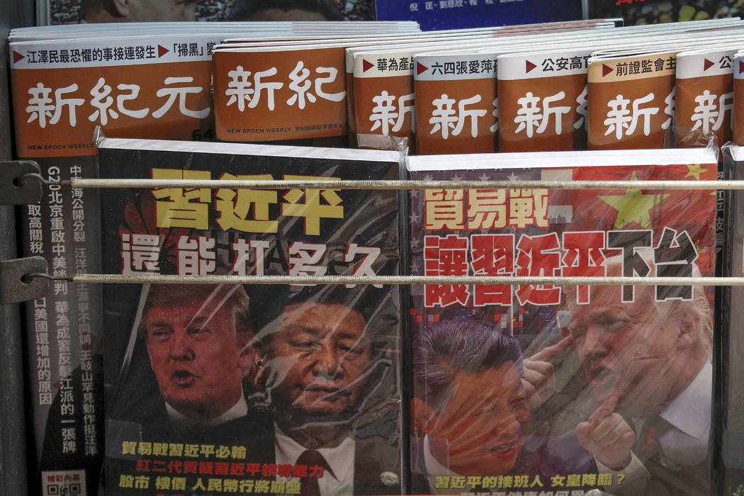 In a July 4, 2019, photo, Chinese magazines with front covers featuring Chinese President Xi Ji ...