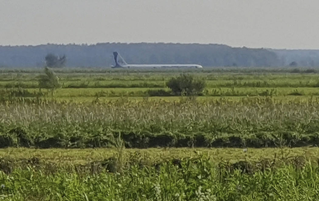 A Russian Ural Airlines' A321 plane is seen after an emergency landing in a cornfield near Rame ...