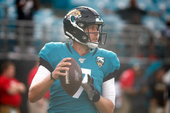 Jacksonville Jaguars quarterback Nick Foles (7) warms up before the first half of an NFL presea ...