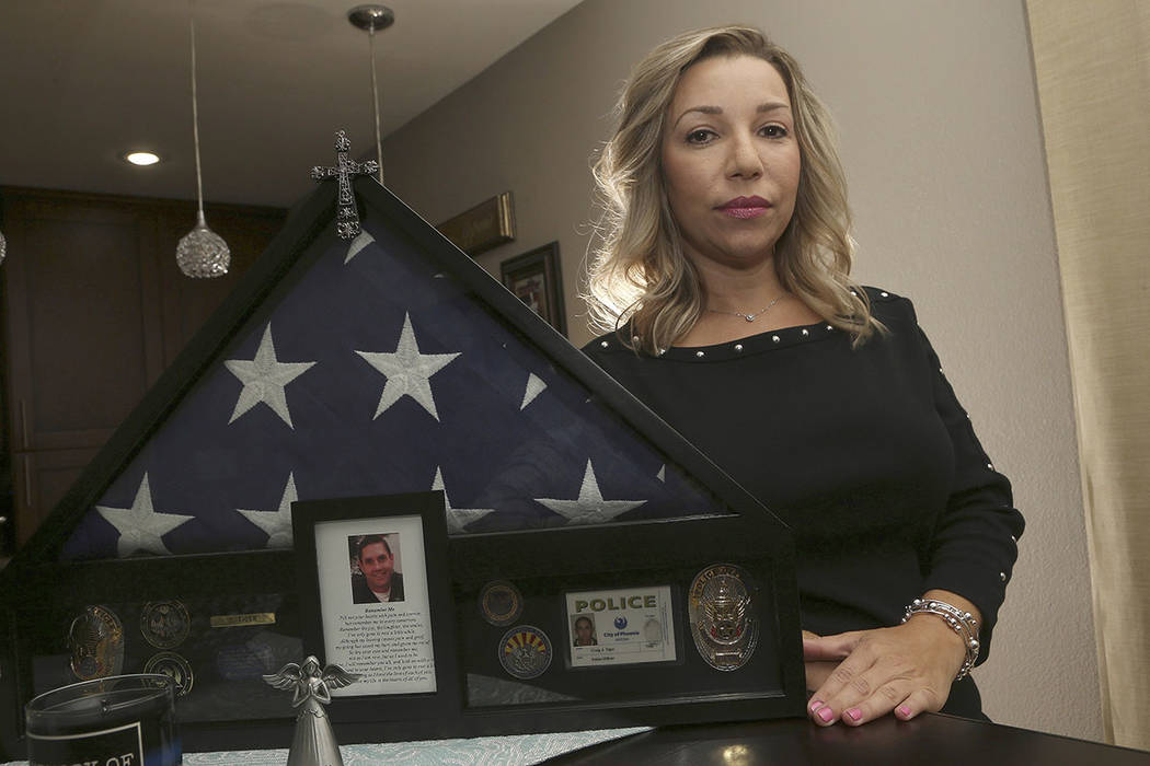 Rebecca Tiger, a former Phoenix police officer, is the widow of Craig Tiger, a Phoenix police o ...