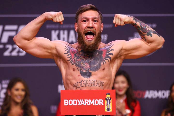 Conor McGregor weighs in ahead of his fight against Khabib Nurmagomedov during the ceremonial w ...