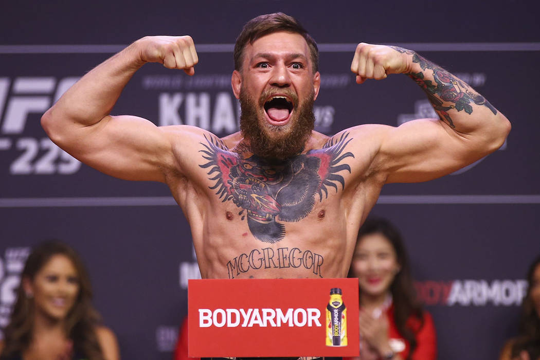 Conor McGregor weighs in ahead of his fight against Khabib Nurmagomedov during the ceremonial w ...