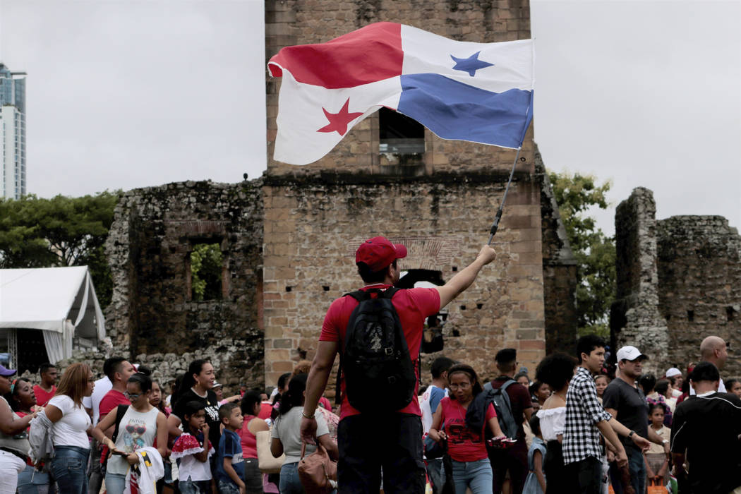 A person waves a Panama flag during the activities celebrating the 500 anniversary of the found ...