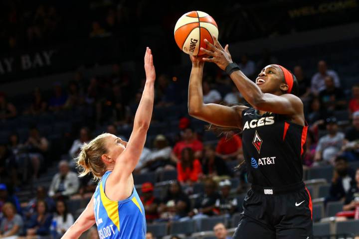 Las Vegas Aces' Jackie Young, right, shoots over Chicago Sky's Courtney Vandersloot (22) during ...