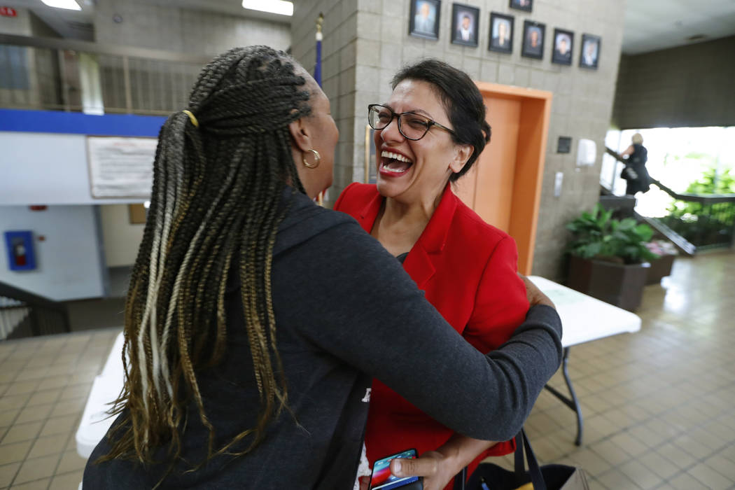 U.S. Rep. Rashida Tlaib, D-Mich., greets a constituent in Wixom, Mich., Thursday, Aug. 15, 2019 ...