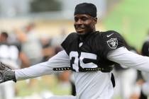 Oakland Raiders free safety Curtis Riley (35) stretches during the NFL team's training camp in ...