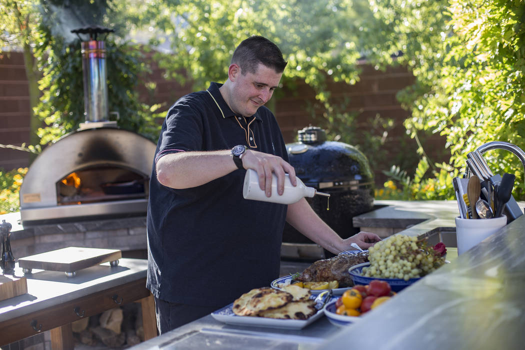 Matt Silverman, chef for HEXX Kitchen + Bar, prepares food in his backyard kitchen in Las Vegas ...