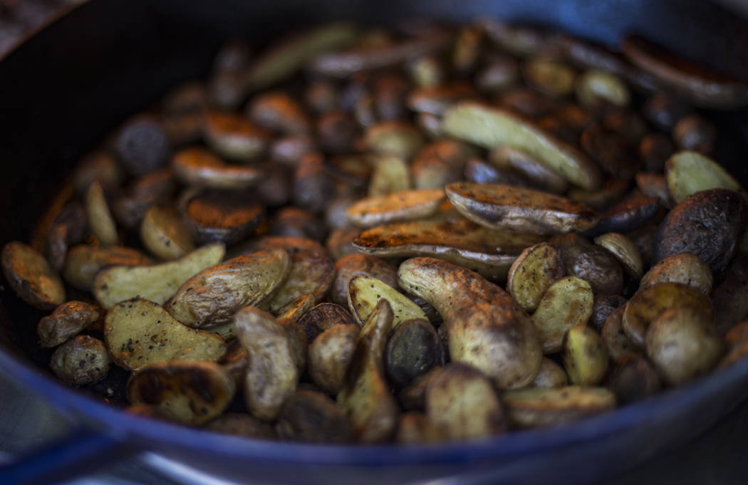 Roasted potatoes n the backyard kitchen of Matt Silverman, chef for HEXX Kitchen + Bar, in Las ...