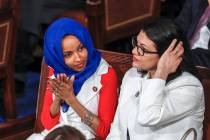 Rep. Ilhan Omar, D-Minn., left, joined by Rep. Rashida Tlaib, D-Mich., listen to President Dona ...