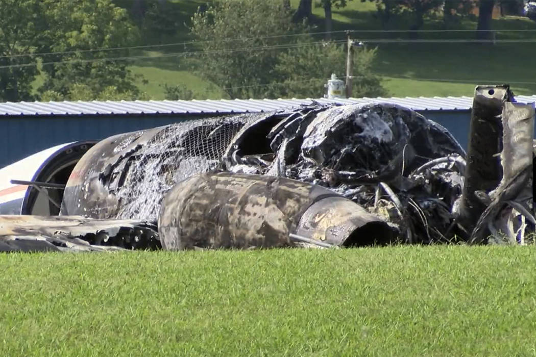 The burned remains of a plane that was carrying NASCAR television analyst and former driver Dal ...