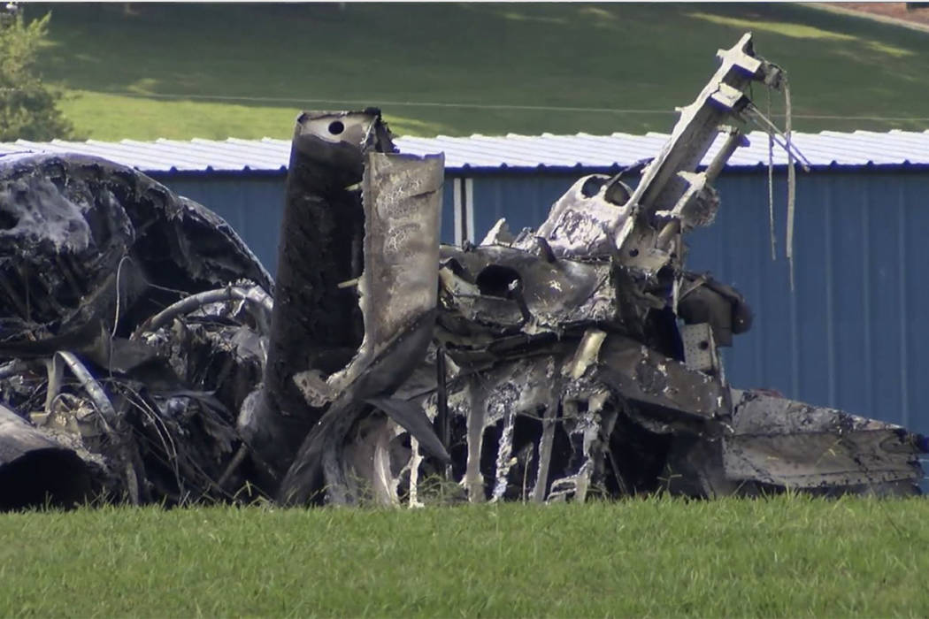 The burned remains of a plane that was carrying NASCAR television analyst and former driver Dal ...