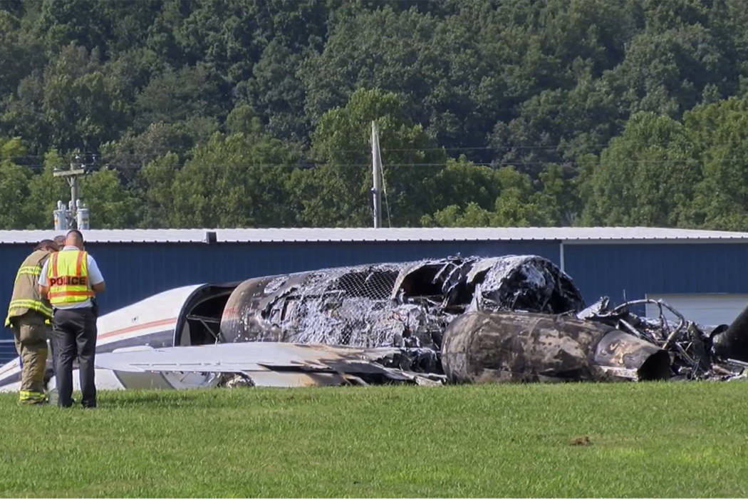 The burned remains of a plane that was carrying NASCAR television analyst and former driver Dal ...