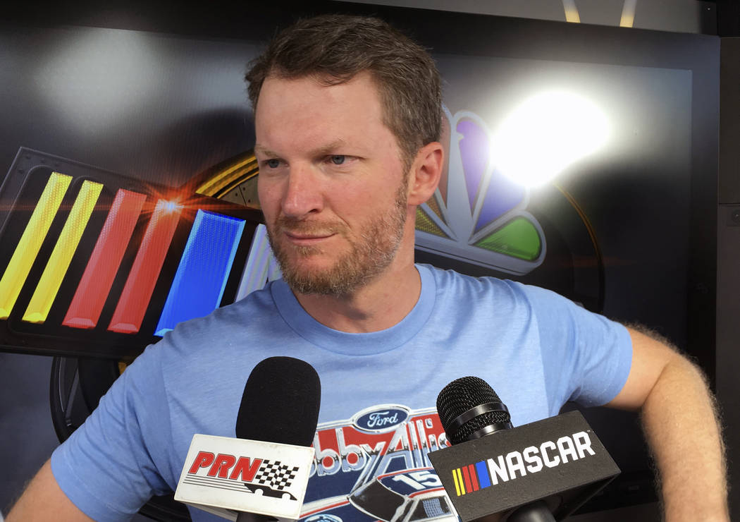 Dale Earnhardt Jr. goes through an interview during NASCAR auto racing pre-race activities at D ...