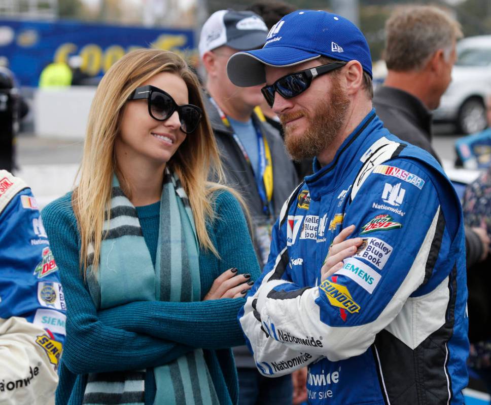 Sprint Cup Series driver Dale Earnhardt Jr. talks with his then-fiance, Amy Reimann, prior to ...