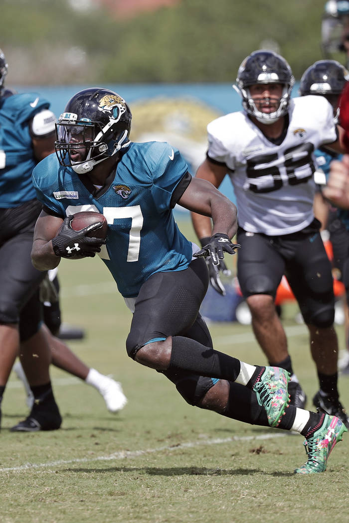 Jacksonville Jaguars running back Leonard Fournette runs with the ball during a play at an NFL ...