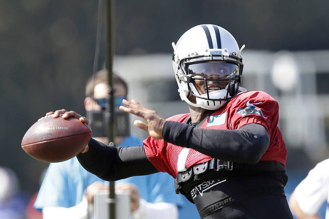 Carolina Panthers quarterback Cam Newton passes during an NFL football training camp with the B ...