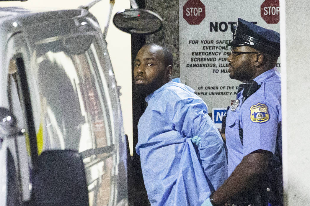 Police take shooting suspect, Maurice Hill, into custody after an hourslong standoff with polic ...